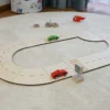 Side view of natural plywood toy road for model cars