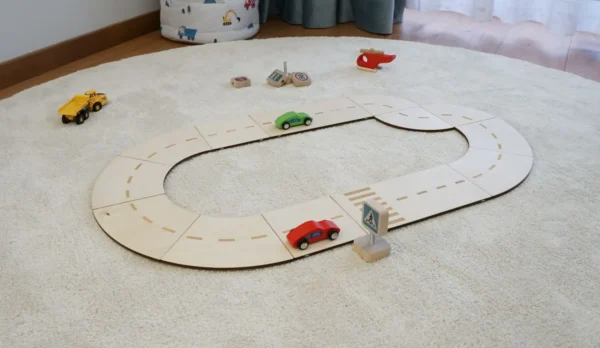 Side view of natural plywood toy road for model cars