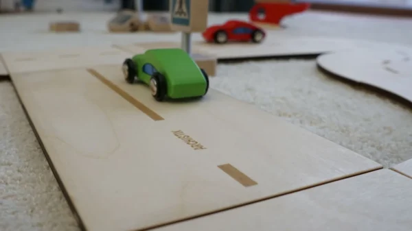 Close-up image of natural plywood toy road for model cars
